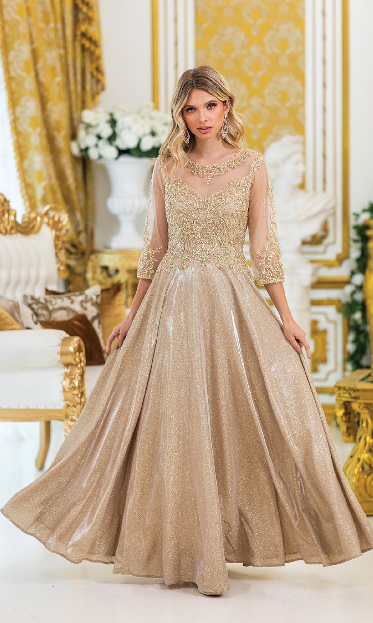 A woman wearing the Lace-Sleeve Long Formal Dress: Dancing Queen 4498 stands in an ornate room with gold and white décor and elegant floral arrangements.