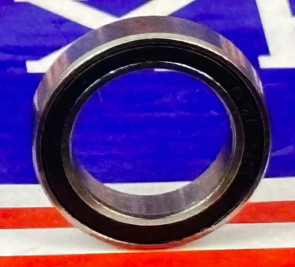 Premium 6701-2RS Bearing 12x18x4 Sealed Ball Bearing close-up view showing rubber seals and steel finish.