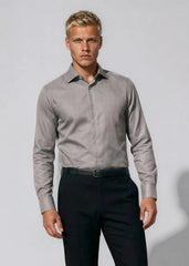 Man wearing a gray shirt and black pants against a white background
