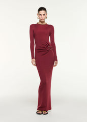 Front view of a model wearing the Gathered Buckle Knit Maxi Dress in Dark Red