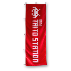 Red Banner with white font 'Taito Station'