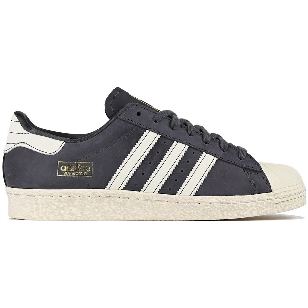 Aurora Adidas Superstar sneaker with white stripes on a white background