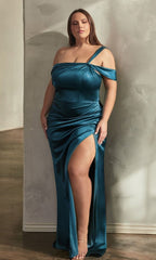 A woman models the One-Shoulder Plus-Size Long Prom Dress CD327C, featuring a high slit, as she poses against a textured wall in softly lit surroundings.