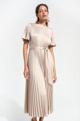 Model wearing Joseph Ribkoff 261752 Signature Pleated Satin Fit & Flare Midi Dress Champagne shop Joseph Ribkoff at Dotique