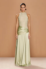 The DALIA GOWN by SONYA MODA — a soft sage green satin dress with a high neckline and elegant floor-length silhouette.