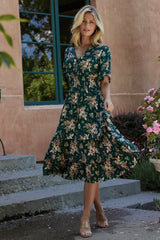 Front view of Spell Boho Midi Dress in topaz with blush floral print on model, V-neckline, smocked waist and midi hem, full outfit shot.
