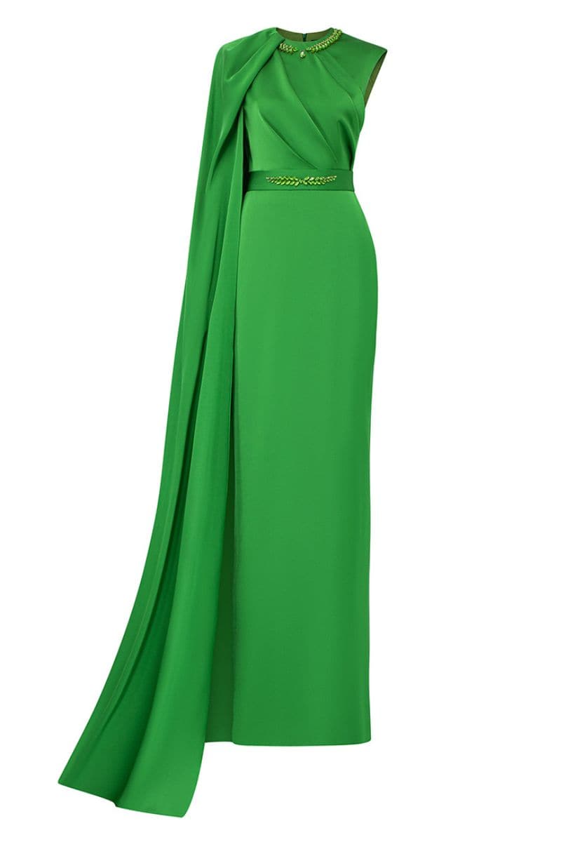 Green one-shoulder silk gown with cape draping from I.H.F, featuring elegant design and flowing fabric.
