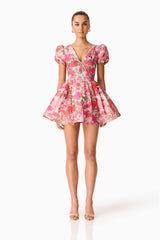 Brunette model wearing the Floralie Short Sleeve Mini Dress in Pink Floral front shot