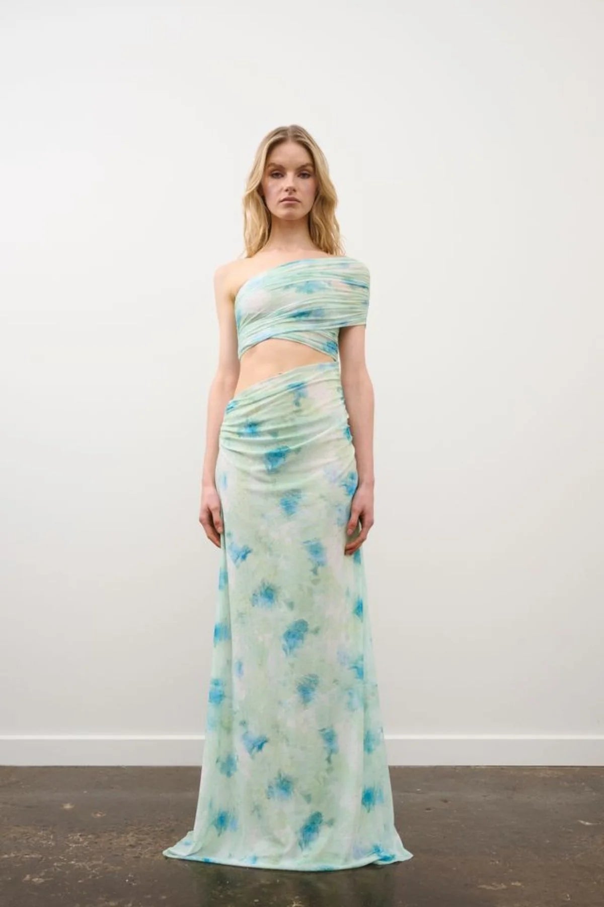 Lia Dress in Multi Green Rhinestone by DŽO, a one-shoulder mesh maxi with abstract print, ruched bodice, and subtle rhinestone detailing.