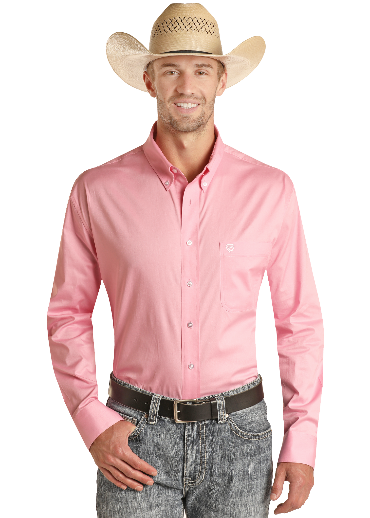 A man stands smiling with one hand in his pocket against a white background, wearing a Rock & Roll Denim Regular Fit Pink Long Sleeve Button Shirt, blue jeans, a black belt, and a straw cowboy hat.