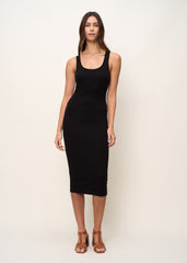Woman in comfortably form fitted, scoop neck tank midi dress made of mid-weight and soft Tencel™ Lyocell stretch rib fabric and eco-friendly dyes in color onyx black, front