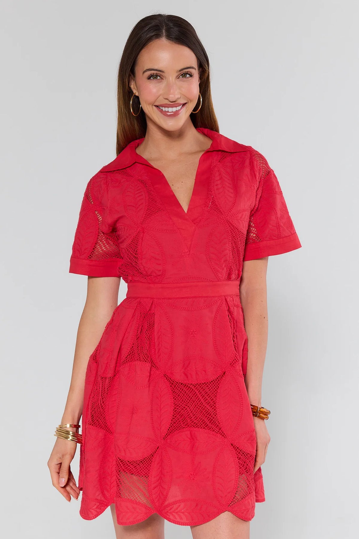 Woman wearing a red dress with a white background