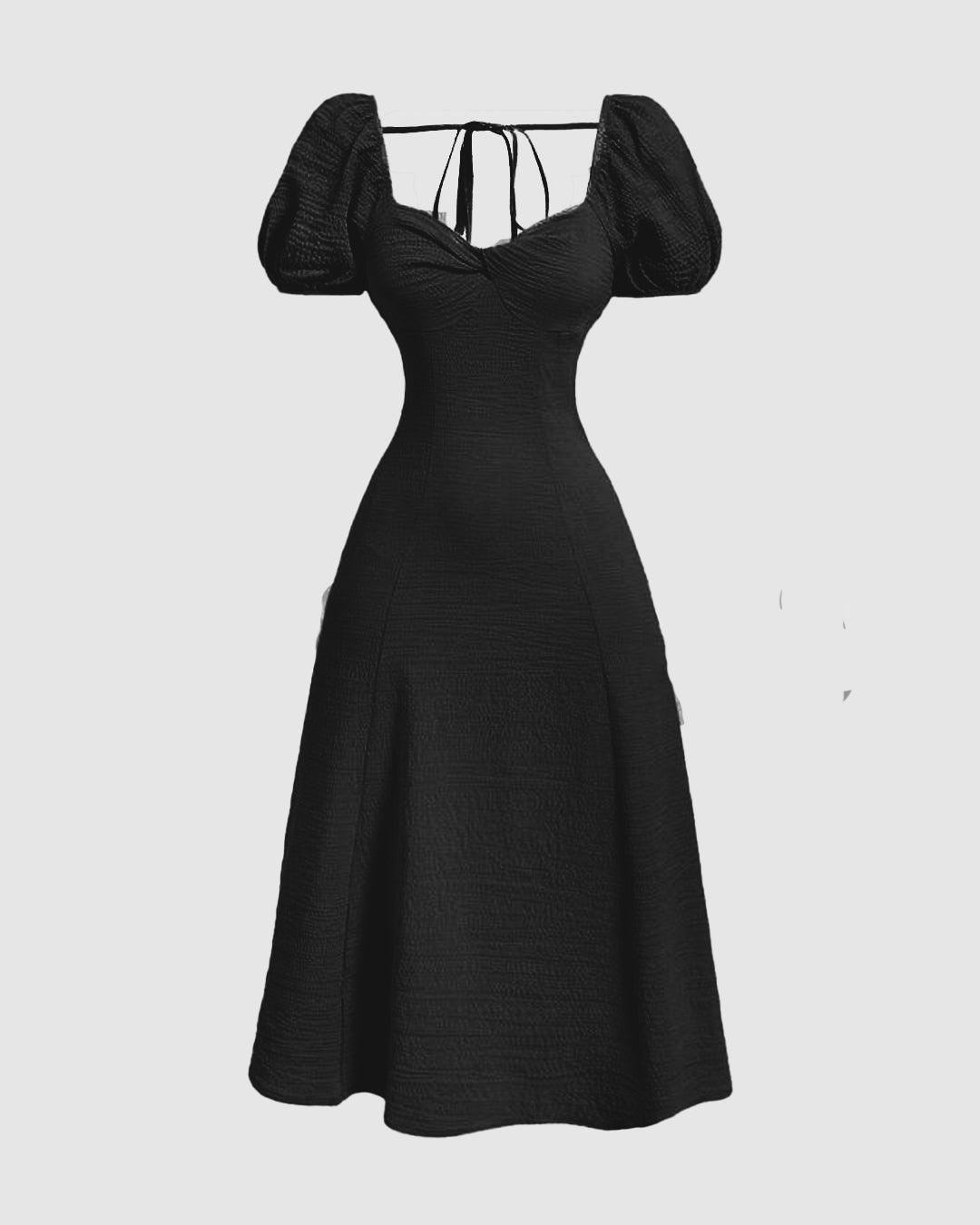 Front view of black puff sleeve midi dress with cinched waist and flared skirt, elegant long black dress.