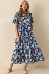 A full view of the blue hydrangea print maxi dress with a notch v-neckline and button front bust.
