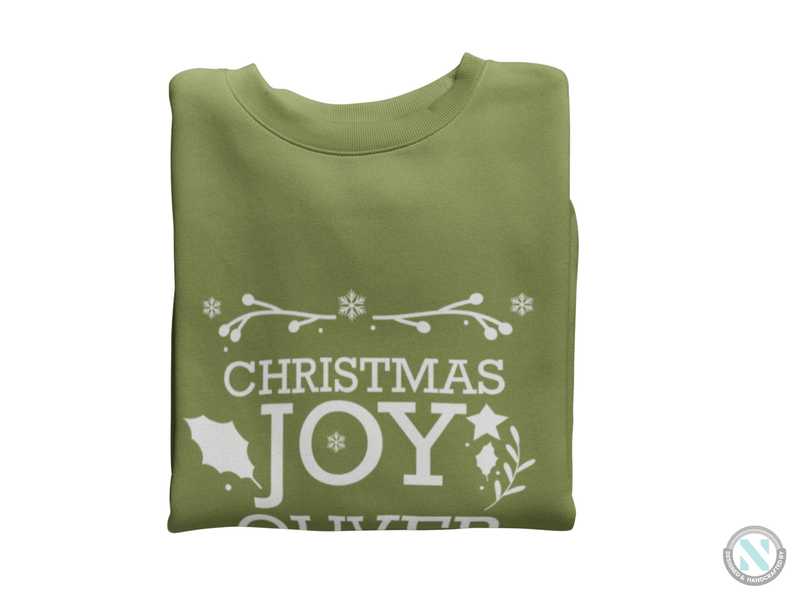 a green t - shirt with the words christmas joy on it