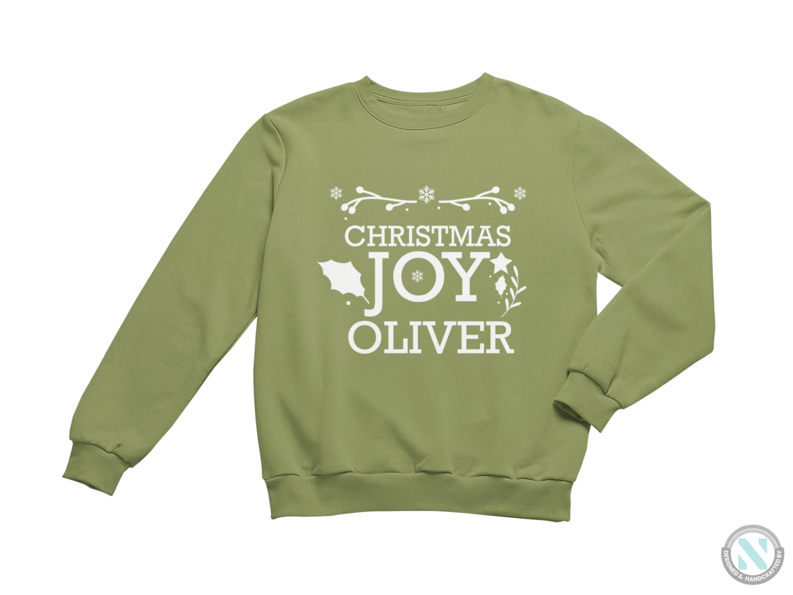 a green christmas sweatshirt with the words christmas joy over it