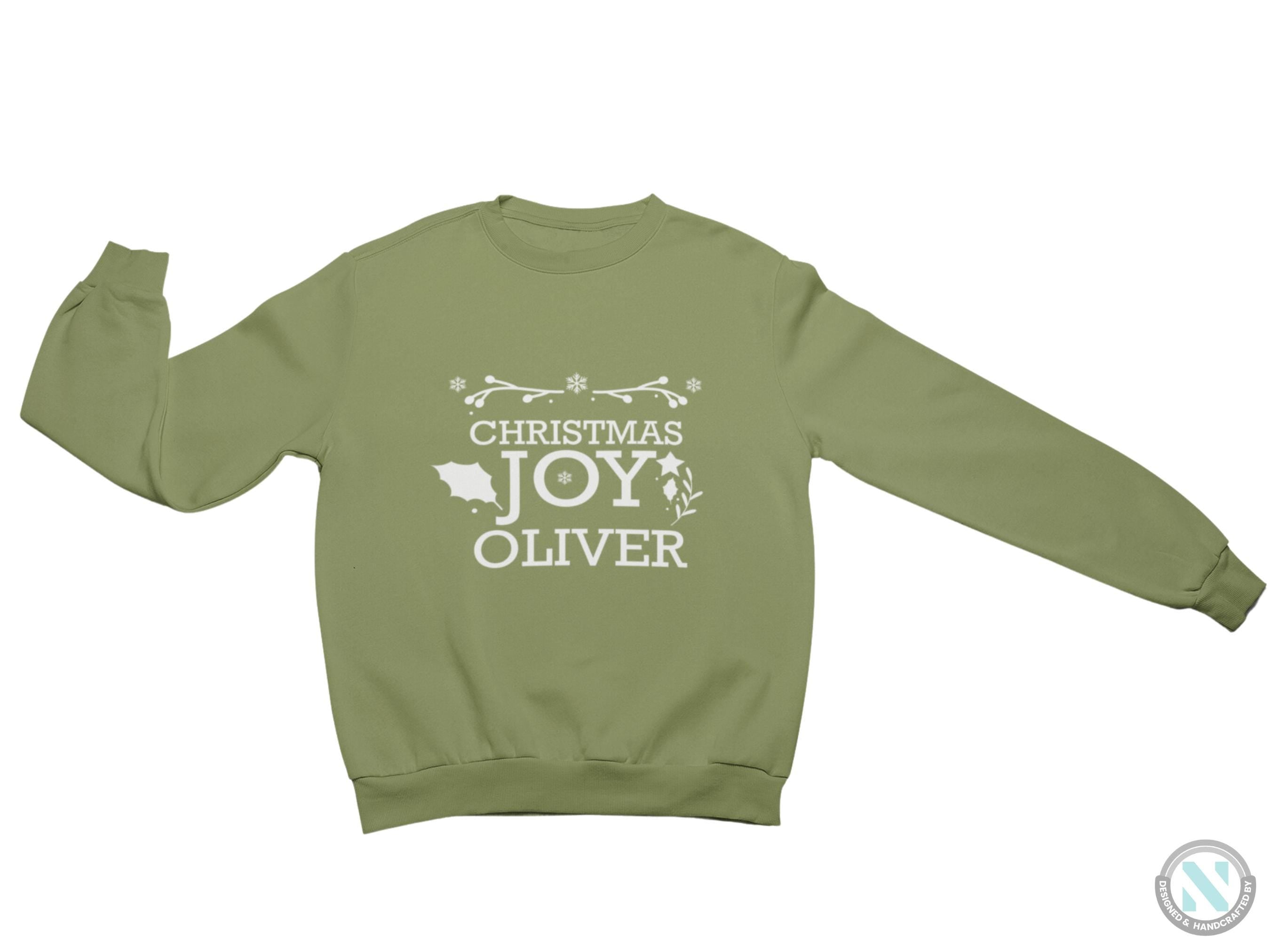 a green sweatshirt with the words christmas joy over it