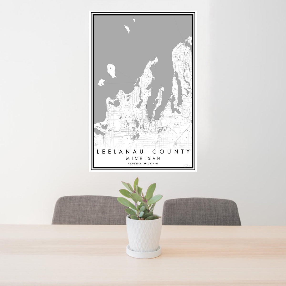 24x36 Leelanau County Michigan Map Print Portrait Orientation in Classic Style Behind 2 Chairs Table and Potted Plant