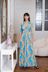 Model wears a formal tropical dress