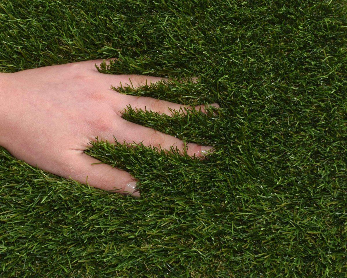 Olympia XTREME 43mmm Artificial Grass Sample Square with hands in fibres