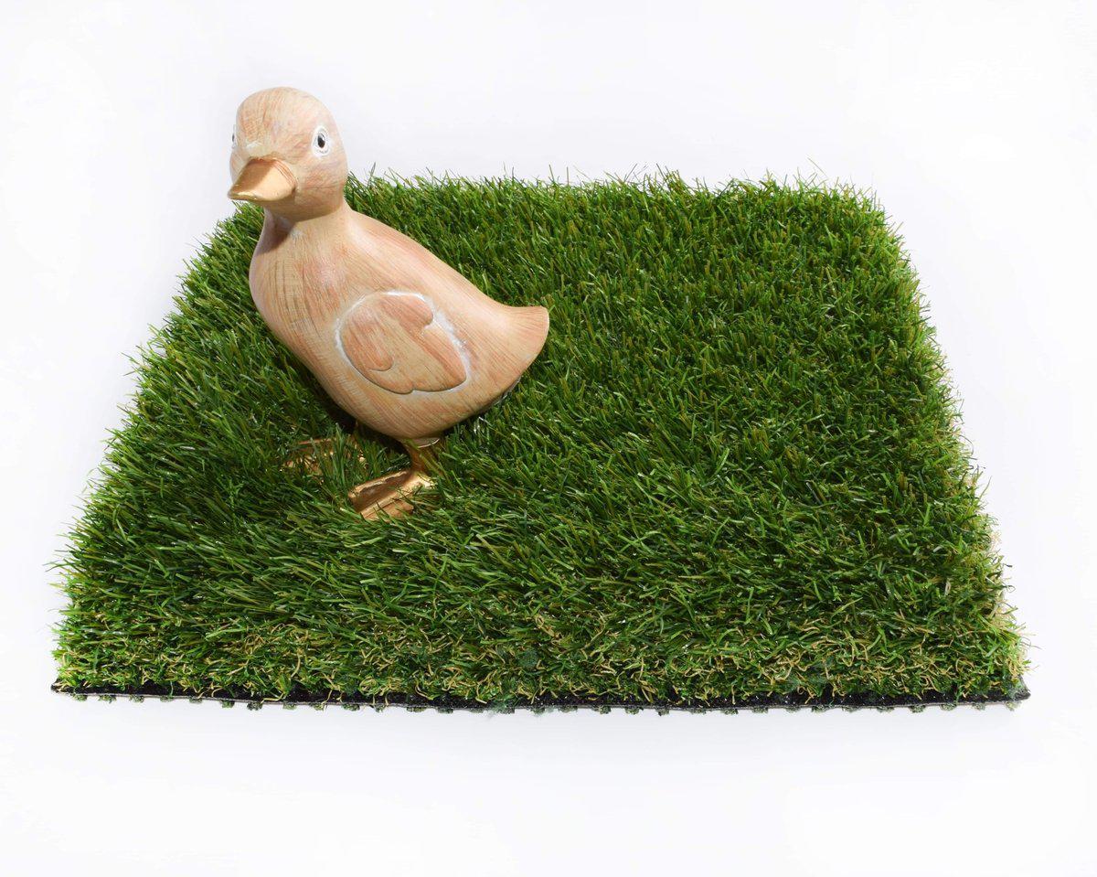 Wooden duck ornament stood on Olympia XTREME 43mmm Artificial Grass Sample Square